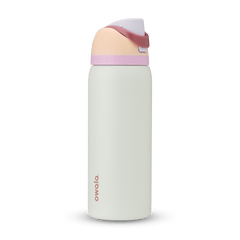 FreeSip 32oz in Coastal Mist, pale mint green body with peach flip cap, dusty rose carry loop, lavender accent band, and pink logo