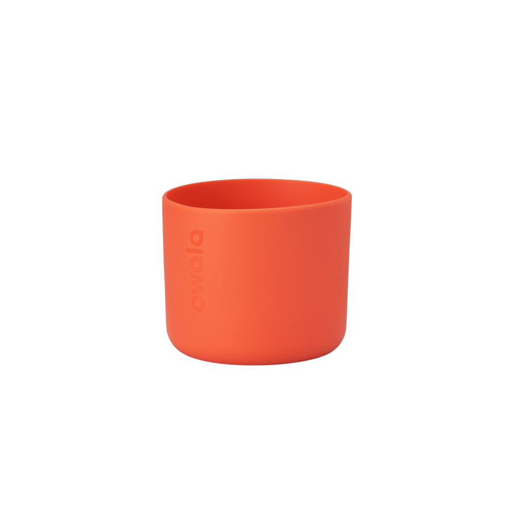 Owala Bottle Boot in bright tangerine orange silicone with tonal Owala logo, short cylindrical form sized for 16oz Kids' FreeSip bottles