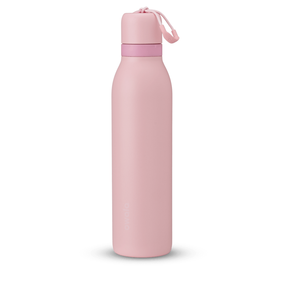 FreeSip Twist 24oz in Rose Quartz, soft pink insulated water bottle with matching pink twist cap, light pink twist cap accent band, and pink carry string with grip