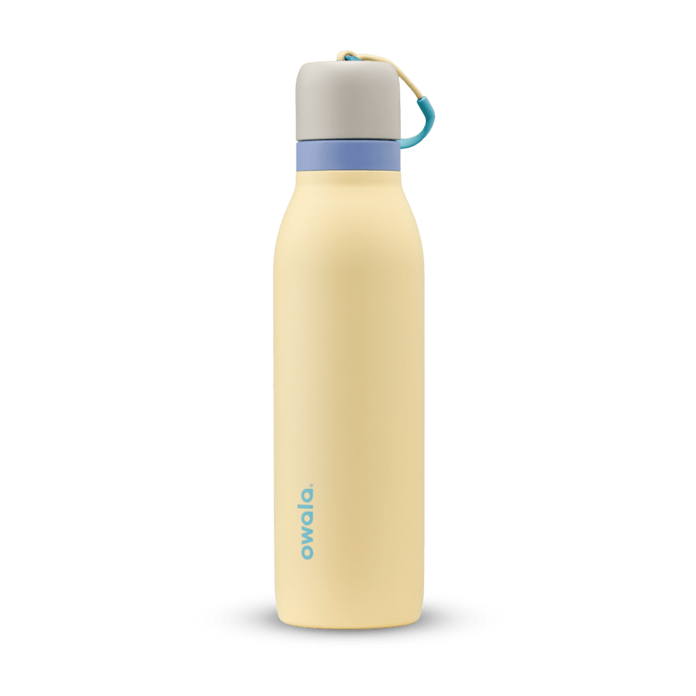 FreeSip Twist 18oz in Sunny Daze, pale yellow insulated water bottle with light gray twist cap, periwinkle blue twist cap accent band, and teal carry string with grip